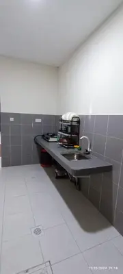 a kitchen with a sink in a room at Aflah Home in Tapah Road
