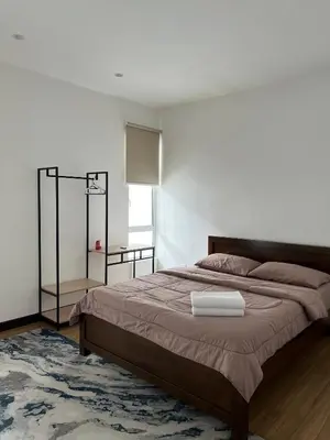 a bedroom with a large bed and a window at Mkm Villa cameron highland in Tanah Rata