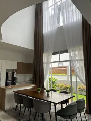 a dining room with a table and chairs at Mkm Villa cameron highland in Tanah Rata