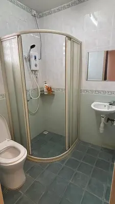 a shower in a bathroom with a toilet and a sink at Comfy21 Homestay Ipoh near Sunway Tambun in Ipoh