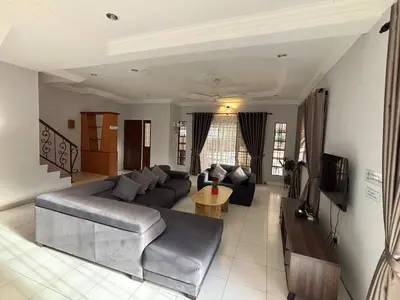 a living room with a couch and a table at Comfy21 Homestay Ipoh in Ipoh