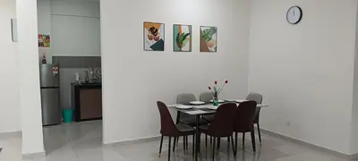 a dining room with a table and chairs at Classic Spot - Meru Raya in Ipoh