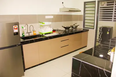 a kitchen with a sink and a counter top at Classic Spot - Meru Raya in Ipoh