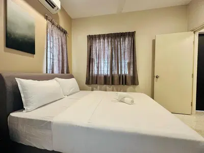 a bedroom with a white bed with a computer mouse on it at New Island Luxe Retreat Vacation Home 14pax Nearby Gurney in Tanjung Bungah