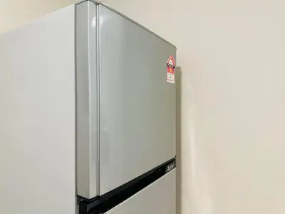 a stainless steel refrigerator with a sign on it at New Island Luxe Retreat Vacation Home 14pax Nearby Gurney in Tanjung Bungah