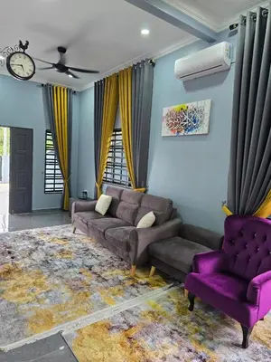a living room with a couch and purple chairs at Kak Nah Homestay A Mus'lim Only in Taiping