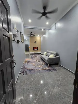 a living room with a couch and a ceiling fan at Kak Nah Homestay A Mus'lim Only in Taiping