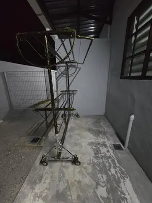 a room with a metal stand in a room at Kak Nah Homestay A Mus'lim Only in Taiping