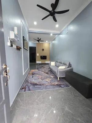 a living room with a couch and a ceiling fan at Kak Nah Homestay A Mus'lim Only in Taiping