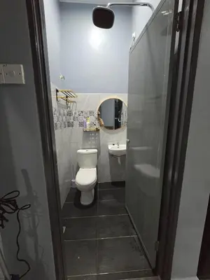 a bathroom with a toilet and a sink at Kak Nah Homestay A Mus'lim Only in Taiping
