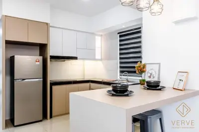 a kitchen with a white counter and a refrigerator at Fusy Homestay Casa Kayangan Meru B2101 in Ipoh