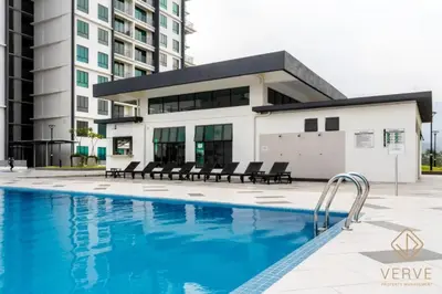 a swimming pool in front of a building at Fusy Homestay Casa Kayangan Meru B2101 in Ipoh