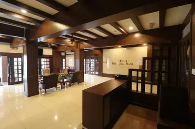 a large room with a lobby with tables and chairs at Iris House Hotel Cameron Highlands in Brinchang