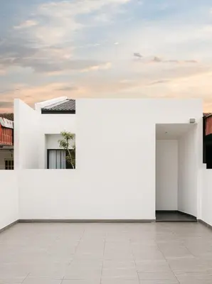 a white building with a sky in the background at Romantic Rooftop Jacuzzi Villa with Sunset Views in Jelutong