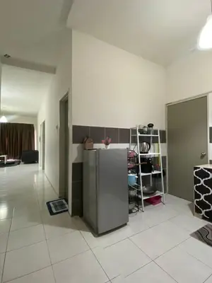 a room with a refrigerator in the middle of a room at Wan AyuRa Homestay in Tanah Rata