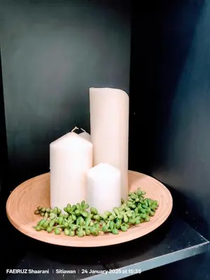 a plate with three candles and a bunch of green grapes at Taman Sejati Sitiawan Cumi Home 4BR with pool, BBQ in Sitiawan
