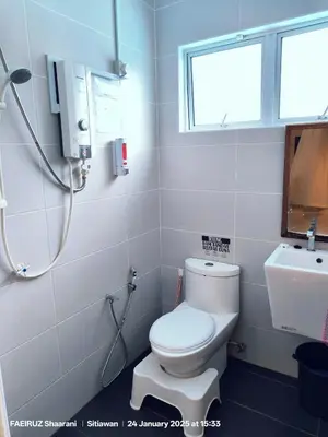 a bathroom with a toilet and a sink at Taman Sejati Sitiawan Cumi Home 4BR with pool, BBQ in Sitiawan