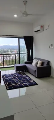 a living room with a couch and a large window at DeRose Homestay, Pekan Ipoh in Ipoh