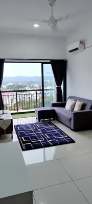 a living room with a couch and a large window at DeRose Homestay, Pekan Ipoh in Ipoh