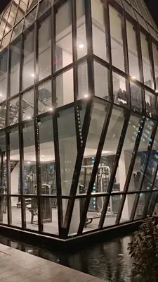 a building with a bunch of glass windows at VIP3BR Romantic Retreat for12 withSea & City Views in Jelutong