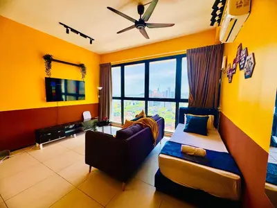 a living room with a couch and a large window at VIP3BR Romantic Retreat for12 withSea & City Views in Jelutong