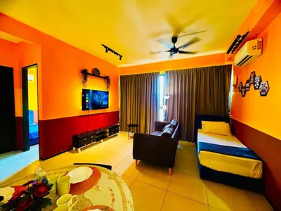 a living room with a bed and a couch at Stunning Sea & City View Apartment in George Town in Jelutong