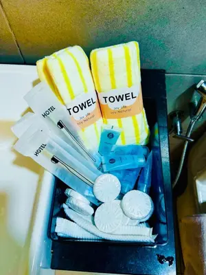 a box filled with toothbrushes and towels at Spacious3BR 12-PaxApartmentStunning Sea &CityViews in Jelutong