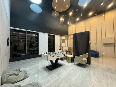 a room with a foosball table and a chair at Deluxe Suite for10 Stunning Sea &City ViewsNetflix in Jelutong