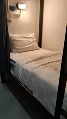 a close up of a bed in a room at 39 Love Lane - Smart Intelligent Inn Georgetown in George Town