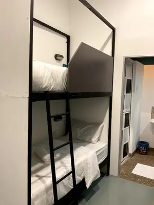 a mirror reflection of a bunk bed in a room at 39 Love Lane - Smart Intelligent Inn Georgetown in George Town