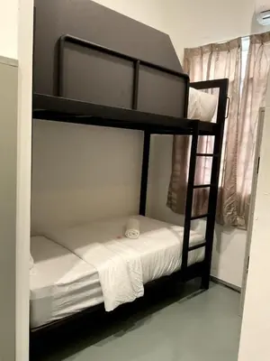 a couple of bunk beds in a room at 39 Love Lane - Smart Intelligent Inn Georgetown in George Town