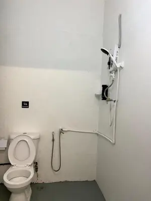 a bathroom with a toilet and a shower at 39 Love Lane - Smart Intelligent Inn Georgetown in George Town