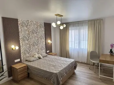 a bedroom with a bed with a teddy bear on it at Penginapan Jolra S3 in Sungai Petani