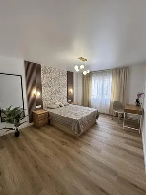a bedroom with a bed and a table and a desk at Penginapan Jolra S3 in Sungai Petani