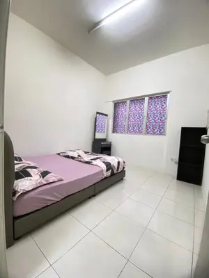 a white room with a bed and a window at Wan AyuRa Homestay 2 in Tanah Rata