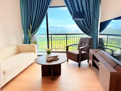 a living room with a couch and a table at The Horizon Retreat in Ipoh