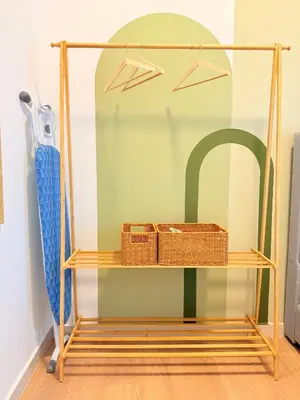 a glass shelf with wicker baskets on it at The Horizon Retreat in Ipoh