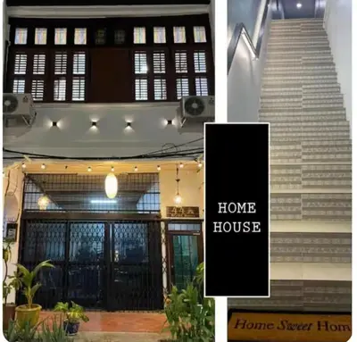 a building with a home house with a staircase at HOME House in George Town