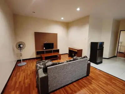 a living room with a couch and a flat screen tv at Iris House Resort & Apartment Cameron Highlands in Cameron Highlands