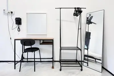 a room with a table and two chairs and a mirror at Homestay Taman Canning Ipoh, Perak - Smarthome in Ipoh