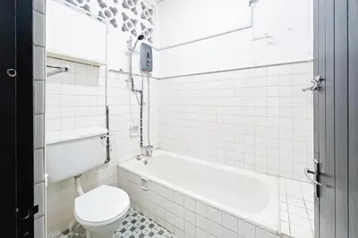 a bathroom with a toilet and a tub and a sink at Homestay Taman Canning Ipoh, Perak - Smarthome in Ipoh