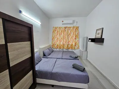 a small bedroom with a bed and a window at Rain Forest Hostel in Ipoh