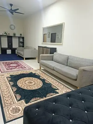 a living room with a couch and a rug at Ed 01 sitiawan homestay in Sitiawan