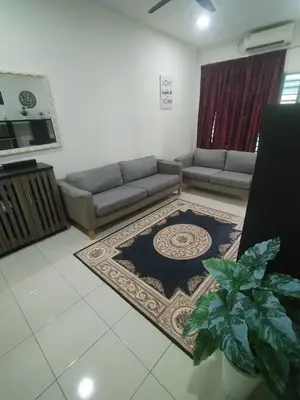 a living room with a couch and a rug at Ed 01 sitiawan homestay in Sitiawan