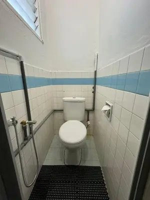 a bathroom with a toilet and a shower at Yipstay Gopeng HomeTown in Gopeng