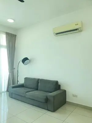 a living room with a blue couch and a air conditioner at Southbay Seaview Condo A23 #10minQueensbay in Bayan Lepas