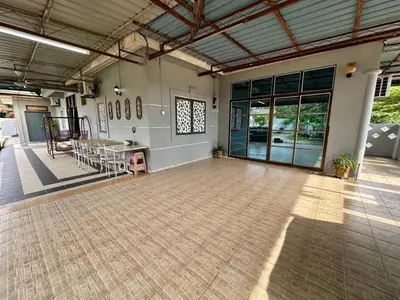an empty room with a table in the middle at Homestay Mohd Lee in Sungai Petani