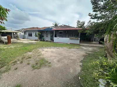 a house with a yard in front of it at Homestay Mohd Lee in Sungai Petani