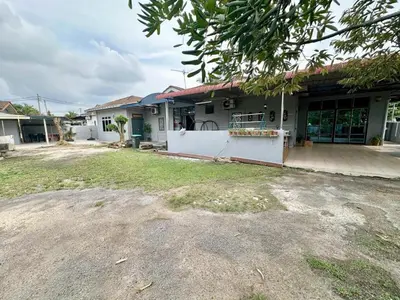 a house with a yard in front of it at Homestay Mohd Lee in Sungai Petani