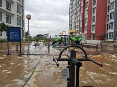 a playground in a parking lot with a park at myuu homestay in Ipoh